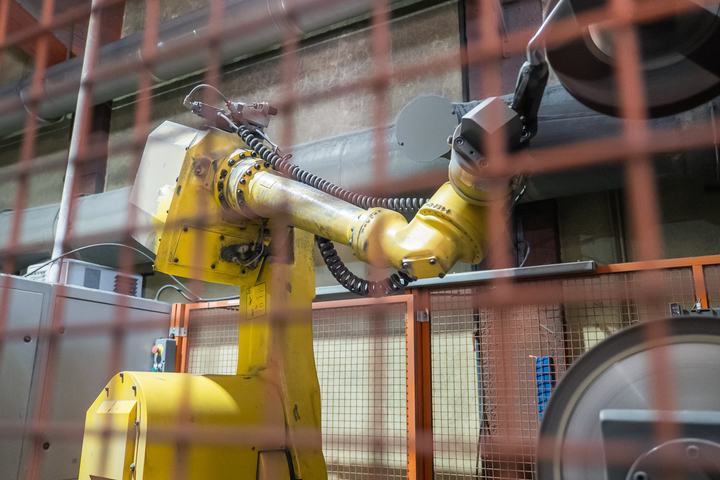 A robotic arm polishing handles