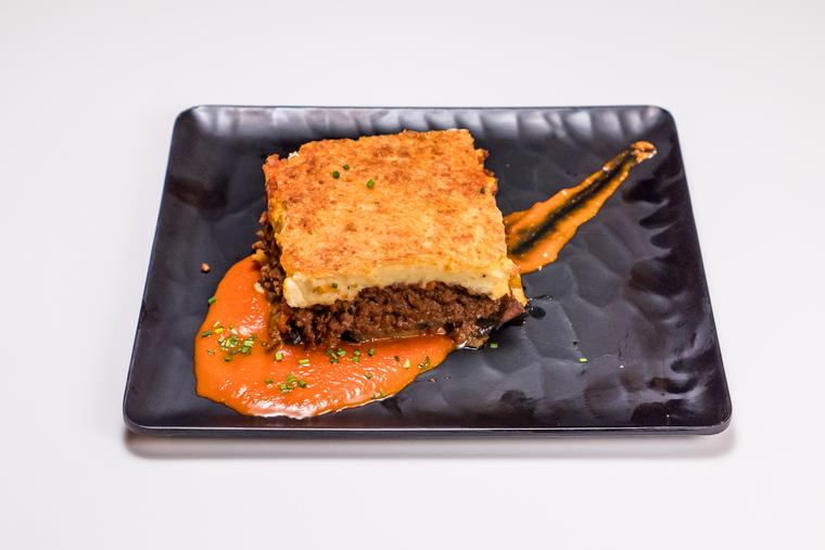 Moussaka on a black plate
