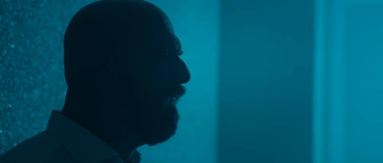 Silhouette of a singer in turquoise light
